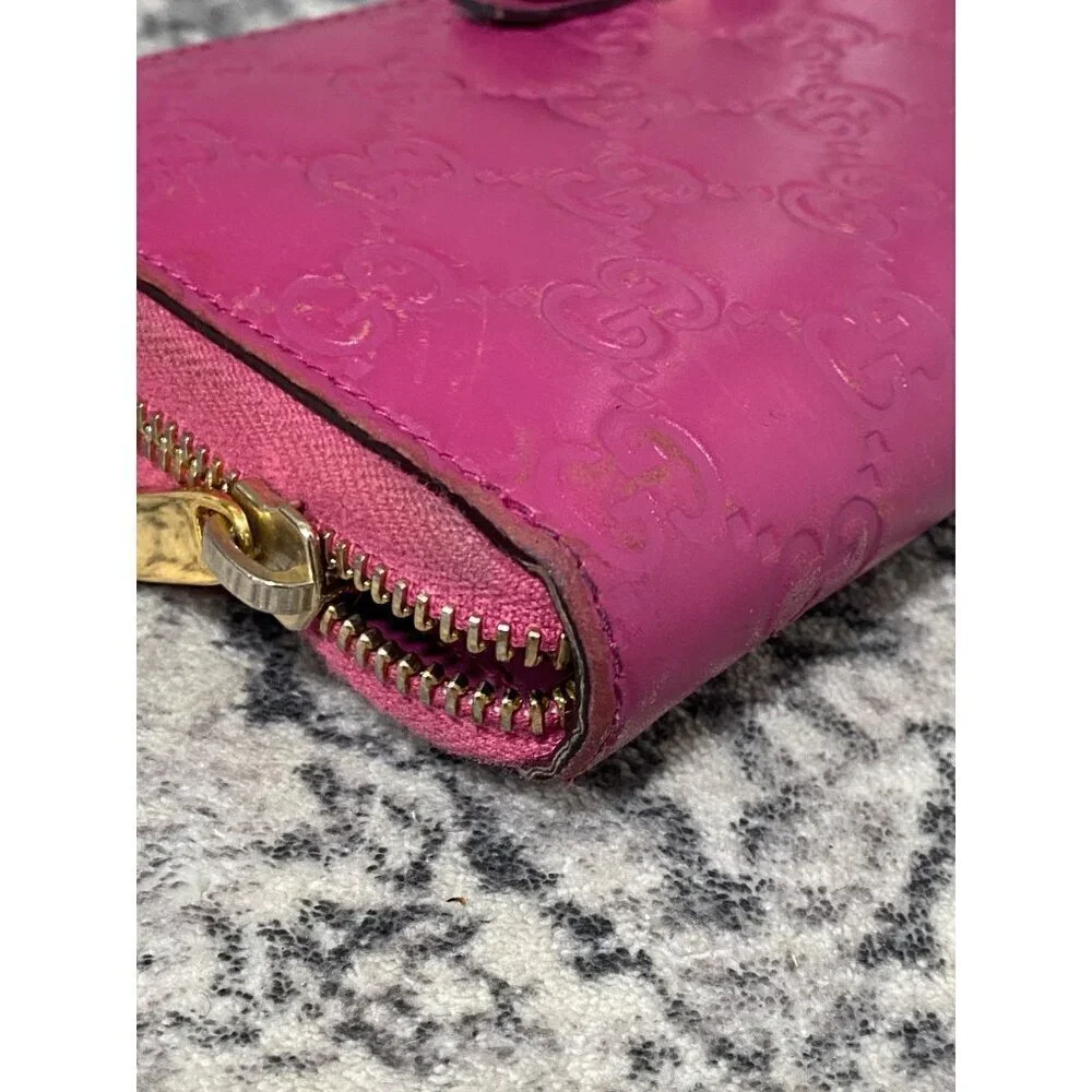 Gucci Guccissima Bow Zip Around Long Wallet in Fuschia